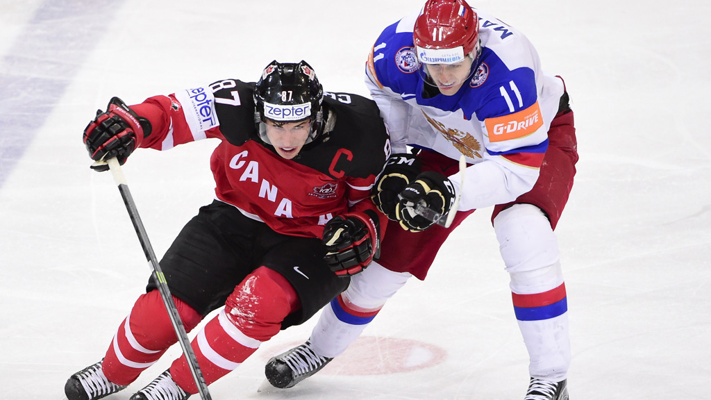 Forward Sidney Crosby of Canada and forward Evgeni Malkin of Russia vie during the gold medal match Canada vs Russia at the 2015 IIHF Ice Hockey World Championships