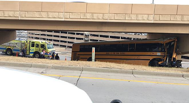 The Latest: School bus driver dies in crash at airport