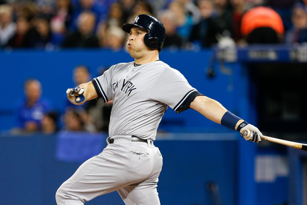 New York Yankees First base Mark Teixeira  watches his hit go foul during an MLB game against the Toronto Blue Jays at the Rogers Center in Toronto ON