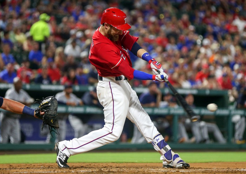 12 AUG 2016 Texas Rangers catcher Jonathan Lucroy connects with a home run during the MLB game between the Detroit Tigers and the Texas Rangers at Globe Life Park in Arlington TX