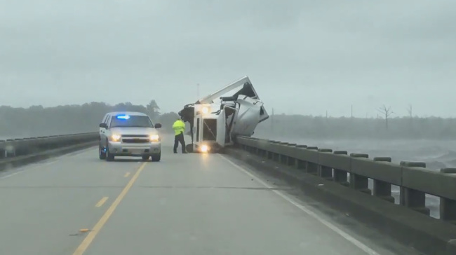 One dead after tractor-trailer overturns on NC bridge from high winds