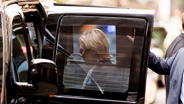 Democratic presidential candidate Hillary Clinton gets into a van as she leaves an apartment building Sunday Sept. 11 2016 in New York. | AP