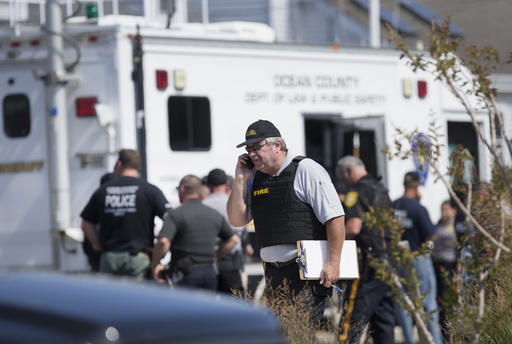 Police gather at a command center in Seaside Park N.J. on Saturday Sept. 17 2016 during an investigation of a pipe bomb which exploded before a charity race to benefit Marines and sailors. No injuries were reported. (Peter Ackerman  The Asbury Park Pr