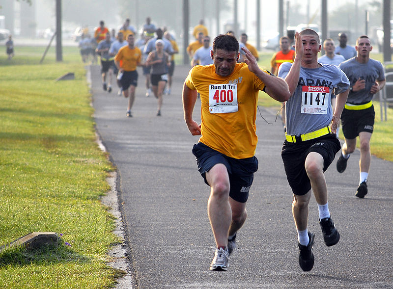 A soldier and sailor compete in a race