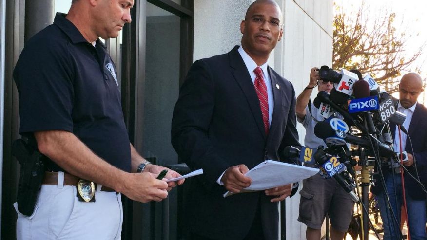 Francis Larkin left chief of the Seaside Park Police Department joins Brad Cohen the acting special agent in charge of the FBI's field office in Newark N.J. at a news conference in front of the Seaside Park Police Department Saturday Sept. 17