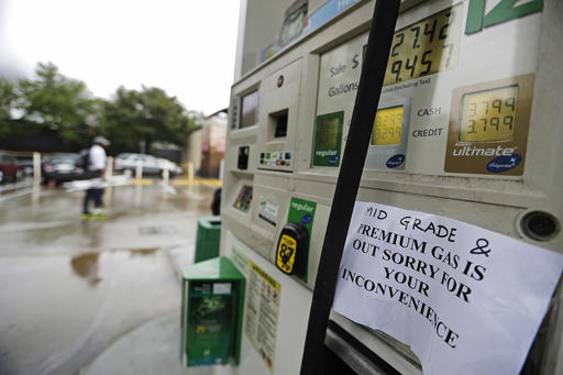 A gas station displays a sign informing customers it is out of certain grades of gasoline in Atlanta Sunday Sept. 18 2016. Colonial Pipeline said it is beginning construction of a temporary pipeline that will bypass a leaki