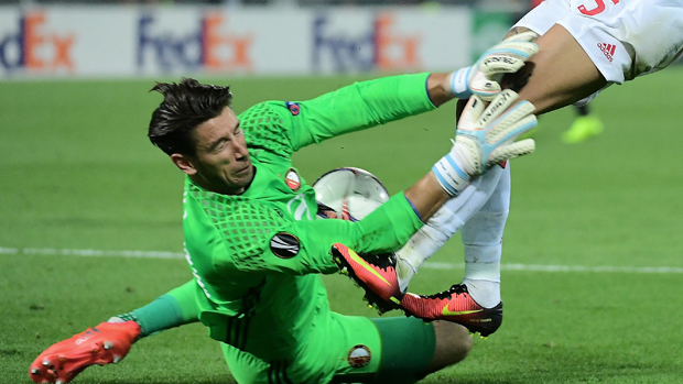 Brad Jones puts his body on the line during his side's win over Manchester United