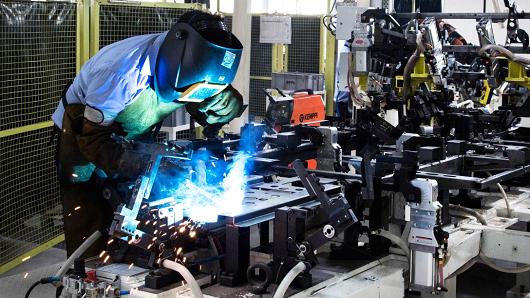 An employee welds the frame of an Eicher Polaris Pvt. Multix personal utility vehicle at the company's factory in Jaipur Rajasthan India