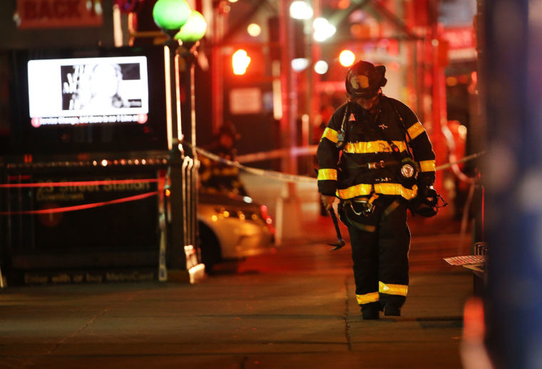 Police firefighters and emergency workers gather at the scene of an explosion in Chelsea Manhattan