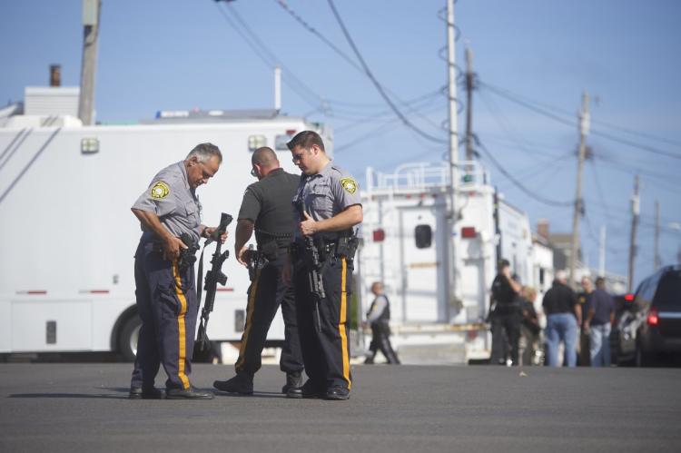 Police officers patrol the scene of Saturday's explosion in Seaside Park N.J