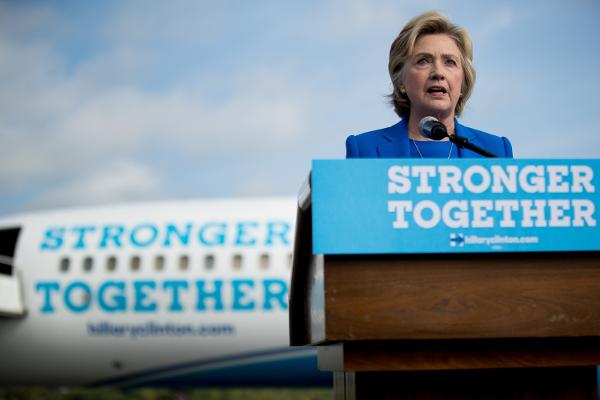 Hillary Clinton speaks to members of the media before boarding her campaign plane at Westchester County Airport in White Plains N.Y. Thursday Sept. 8 2016