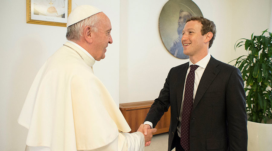 Pope Francis shakes hands with Facebook CEO Mark Zuckerberg during a meeting at the Vatican