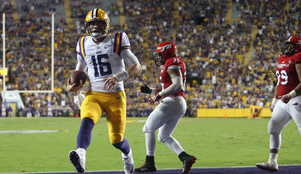 Sep 10 2016 Baton Rouge LA USA LSU Tigers quarterback Danny Etling runs the ball into the end zone for a touchdown in front of Jacksonville State Gamecocks linebacker Quan Stoudemire during the second half at Tiger Stadium. LSU defeated Ja