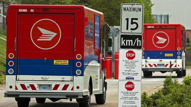 Postal vans arrive at the post office in Halifax on Monday