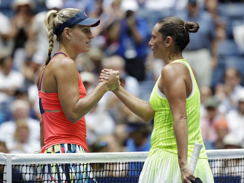 Angelique Kerber of Germany left greets Roberta Vinci of Italy after winning their quarterfinal match of the U.S. Open tennis tournament Tuesday Sept. 6 2016 in New York