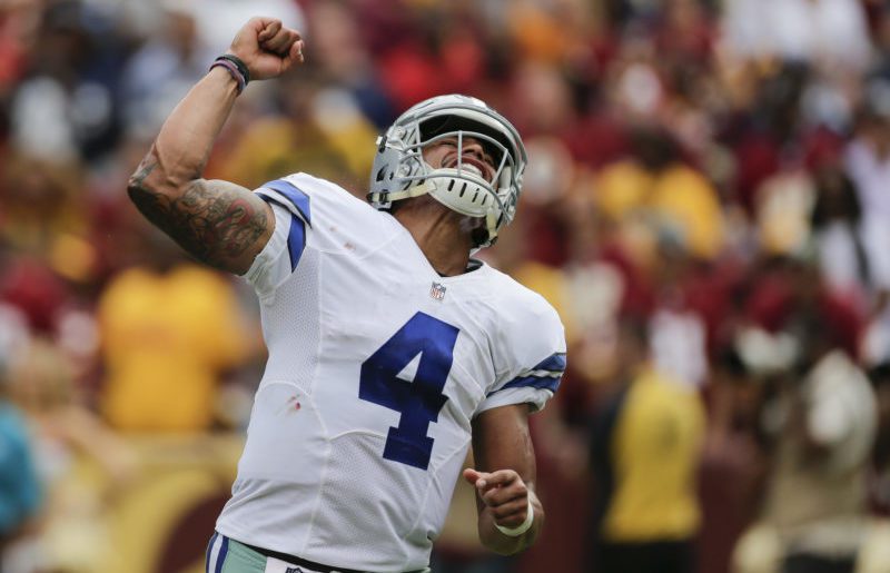 Dallas Cowboys quarterback Dak Prescott celebrates running back Albert Morris touchdown during the second half. The Cowboys defeated the Redskins 27-23