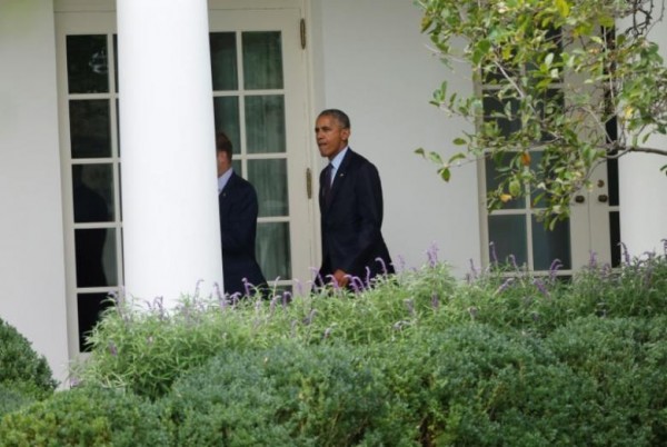 President Barack Obama walks to the the Oval Office of the White House