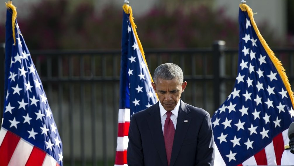 President Barack Obama bows his head for a moment of silence before delivering remarks at the Sept. 11 memorial observance ceremony at the Pentagon Sunday Sept. 11 2016