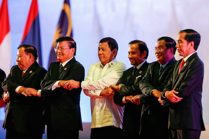 Prime Minister Hun Sen second from right poses with other regional leaders at the Asean Summit in Vientiane on Tuesday