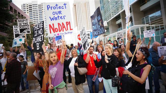 Protesters chant during a rally