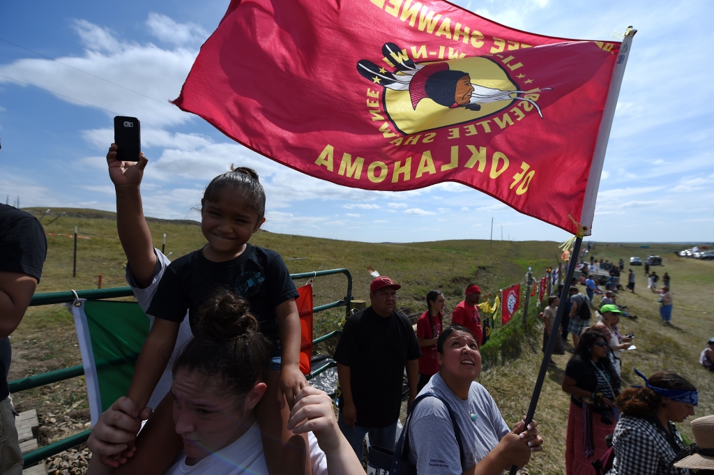 Protestors gather at the blocked entrance to a construction site for the Dakota Access Pipeline to express their opposition to the pipeline near an encampment where hundreds of people have gathered to join the Standing Rock Sioux Tribe's to protest