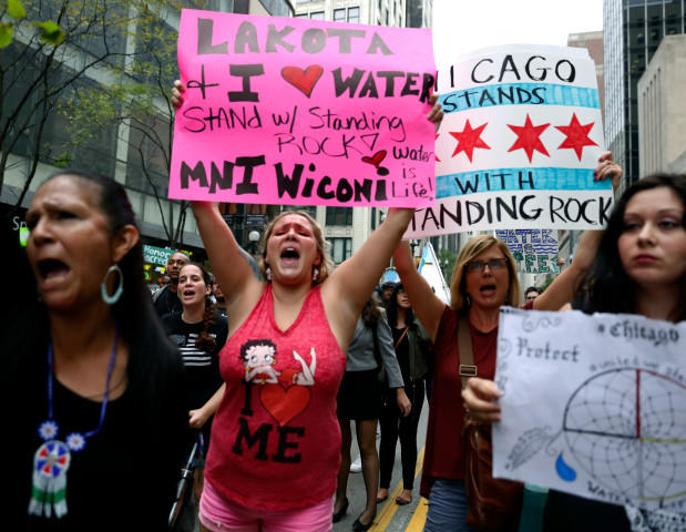 Protestors against the four-state Dakota Access pipeline march in downtown Friday Sept. 9 2016 in Chicago