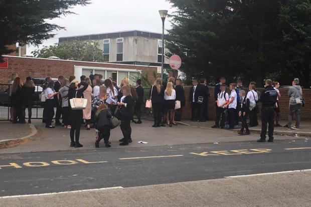 Parents clash with police at school gates as 50 students sent home on first day of school over uniform