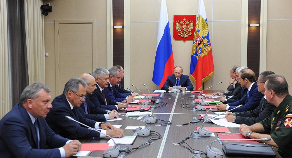 Russian President Vladimir Putin center chairs a meeting in the Kremlin on the key points of the state armament program 2018-35