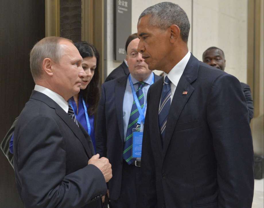 Russian President Vladimir Putin left speaks with U.S. President Barack Obama in Hangzhou in eastern China's Zhejiang province Monday Sept. 5 2016. ORG XMIT MOSB104