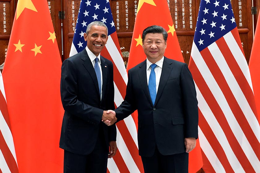 Chinese President Xi Jinping and US President Barack Obama shake hands during their meeting at the West Lake State Guest House in Hangzhou China