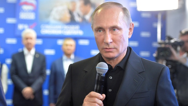 Russian President Vladimir Putin speaks at the United Russia party's campaign headquarters in Moscow on Sunday