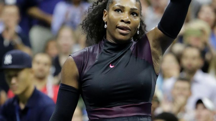 Serena Williams of the United States waves after defeating Ekaterina Makarova of Russia 6-3 6-3 in the first round of the U.S. Open tennis tournament Tuesday Aug. 30 2016 in New York