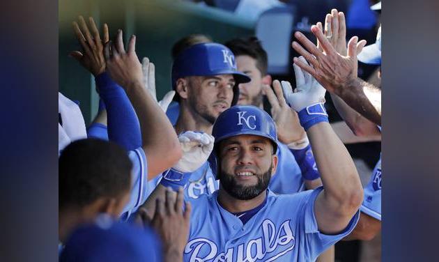 Kansas City Royals&#039 Kendrys Morales celebrates in the dugout after hitting a two-run home run during the sixth inning of a baseball game against the Chicago White Sox Sunday Sept. 18 2016 in Kansas City Mo