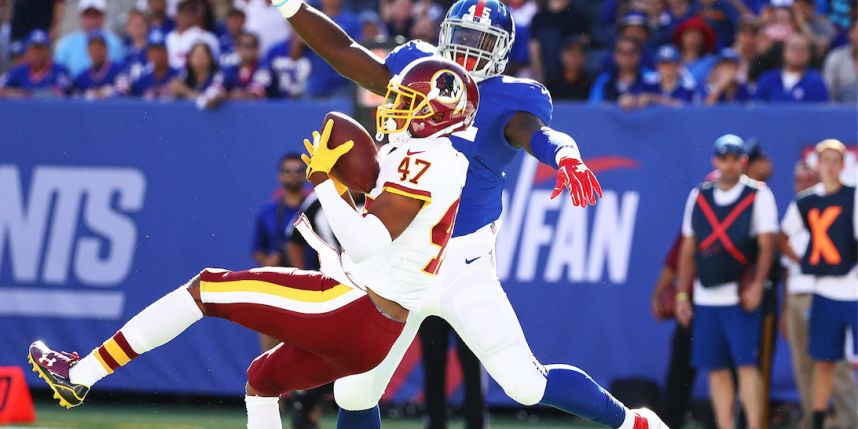 Quinton Dunbar picks off Eli Manning in the third quarter Sunday at Met Life Stadium