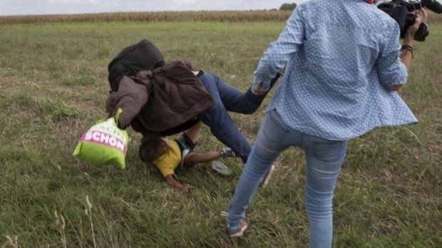 Camera operator Petra Laszlo tripping Osama Mohsen and his son as they tried to escape