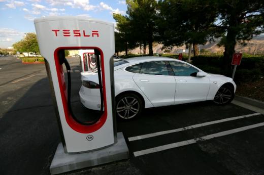 A Tesla Model S charges at a Tesla Supercharger station in Cabazon California