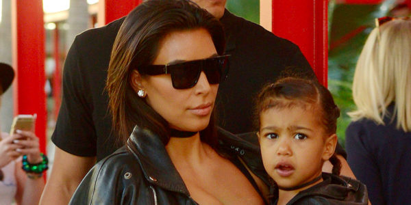 Kim Kardashian holds North West