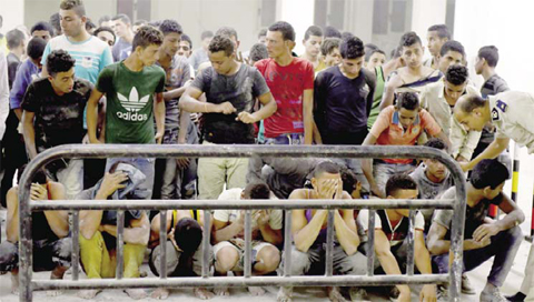 ROSETTA Egypt Survivors from a boat that capsized off Egypt’s north coast are seen in a police station yesterday. — AFP