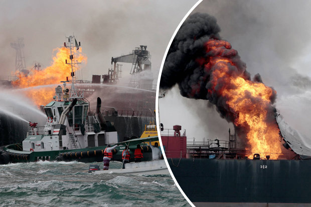 RUETERS    
     BURNING UP The furious blaze was tackled by emergency tug boats