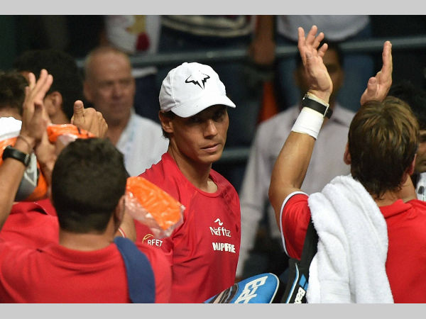 Rafael Nadal and his team members celebrate after their victory over India