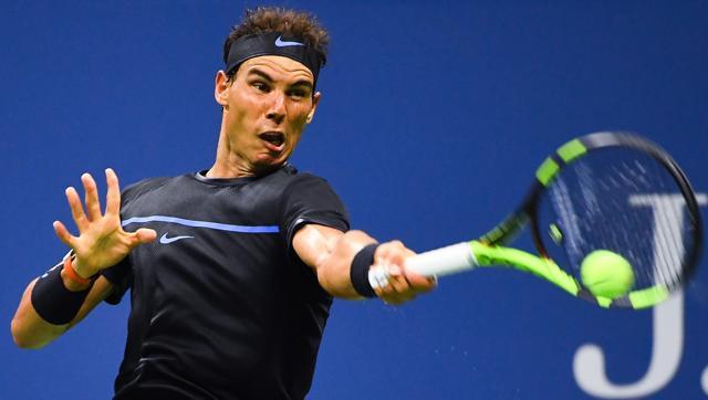 Rafael Nadal of Spain returns a shot to Andreas Seppi of Italy during his second round match