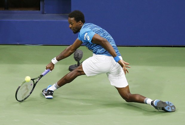 Gael Monfils of France returns a shot to Lucas Pouille of France during the quarterfinals of the U.S. Open tennis tournament Tuesday Sept. 6 2016 in New York