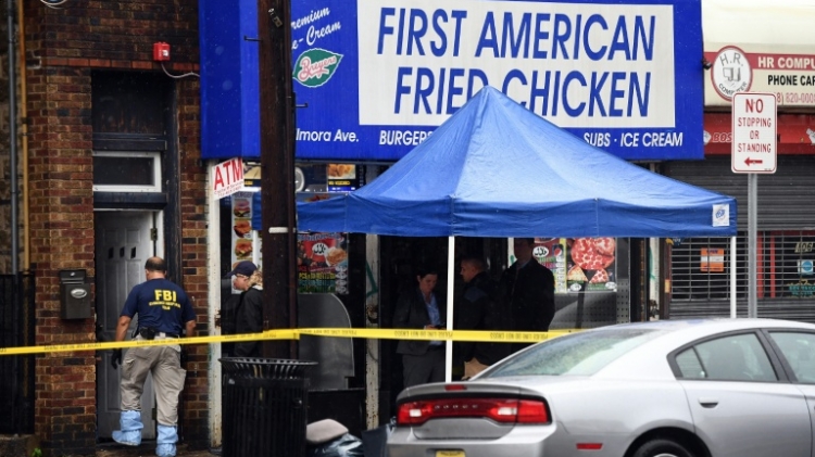 FBI agents investigate inside the family restaurant and adjoined apartment of Ahmad Khan Rahami in Elizabeth New Jersey