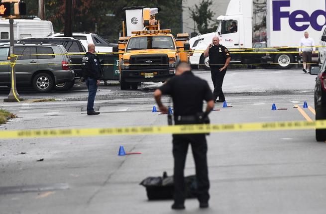 Law enforcement officers secure the area where they allegedly arrested terror suspect Ahmad Khan Rahami following a shootout in Linden New Jersey