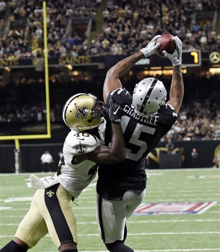 Oakland Raiders wide receiver Michael Crabtree pulls in a touchdown reception over New Orleans Saints cornerback Ken Crawley in the second half of an NFL football game in New Orleans Sunday Sept. 11 2016