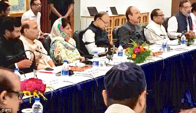 Union Home Minister Rajnath Singh sits next to Chief Minister Mehbooba Mufti at the meeting of the All Party delegation and the Jammu and Kashmir Government