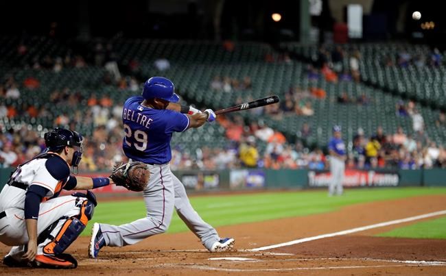 Texas Rangers&#39 Adrian Beltre hits a home run as Houston Astros catcher Jason Castro reaches for the pitch during the second inning of a baseball game Tuesday Sept. 13 2016 in Houston