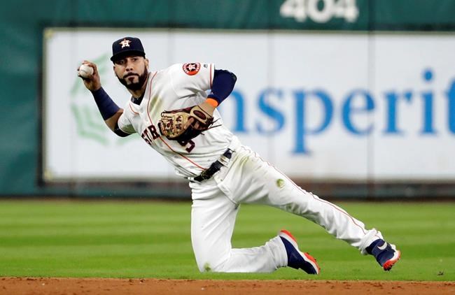 Houston Astros second baseman Marwin Gonzalez holds the ball after fielding an RBI single by Texas Rangers&#39 Jonathan Lucroy during the eighth inning of a baseball game Wednesday Sept. 14 2016 in Houston