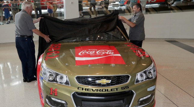 CHARLOTTE NC- AUGUST 03  Bobby Allison and Tony Stewart reveal the car's new paint scheme during the No. 14 Darlington Throwback Announcement True Speed Press Conference at NASCAR Hall of Fame