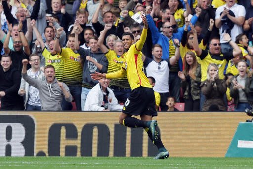 Watford's Etienne Capoue celebrates after scoring a goal during the English Premier League soccer match between Watford and Manchester United at Vicarage Road in London Sunday Sept. 18 2016